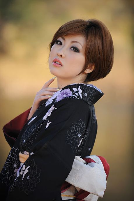 Short haired asian model in a kimono with large soft breasts