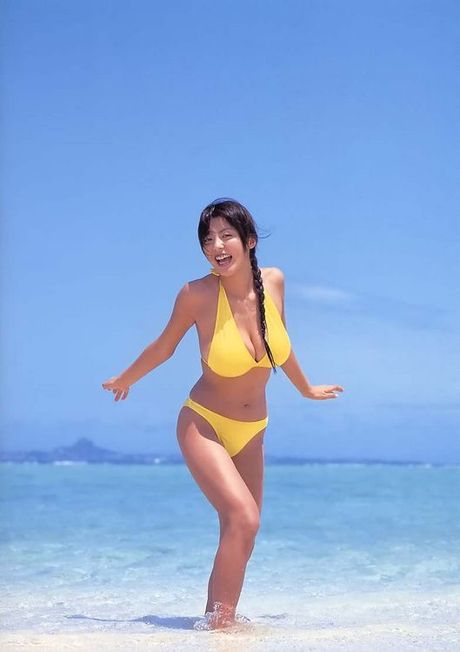 Plump boobs spilling out of a tight corset worn by asian model