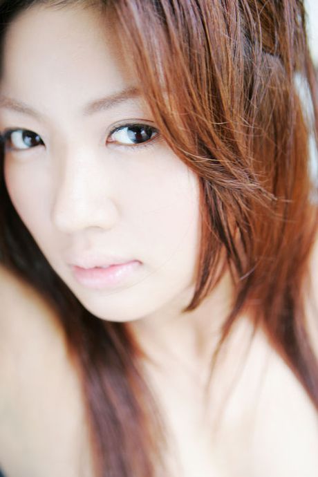 Hot asian fox showing off her voluptuous breasts in a bikini