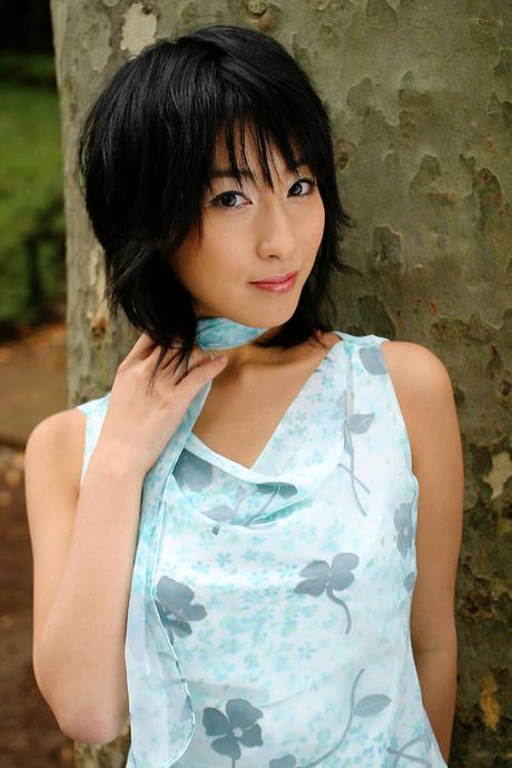 Alluring asian beauty intices with her big boobs and little dress