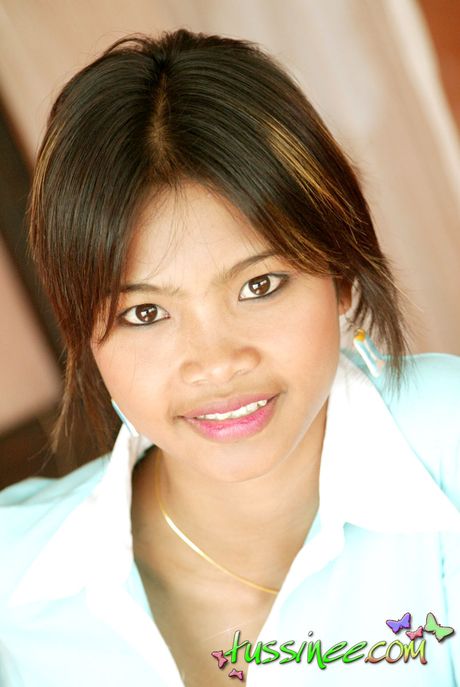 Sweet and innocent Thai teen Tussinee shows off her sexy little body