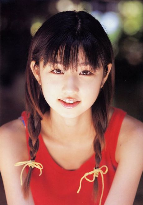 Cute petite asian babe allurs and intices in her red bikini