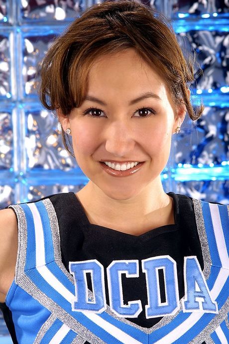 Pretty Asian girl in her blue cheerleader uniform