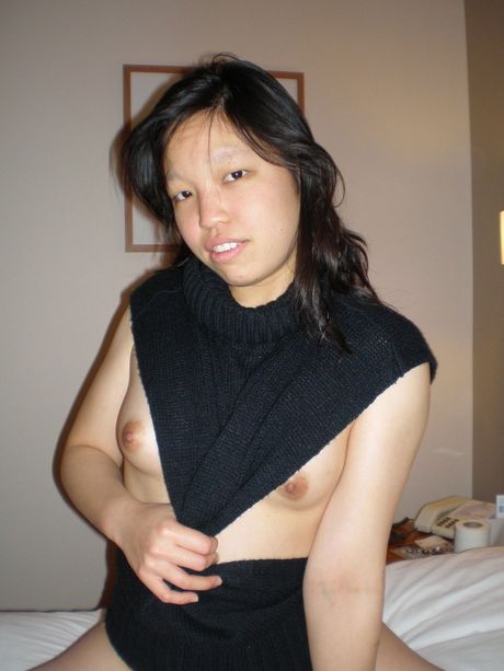 Amateur Asian girl with tiny tits strips and gets her pussy licked out