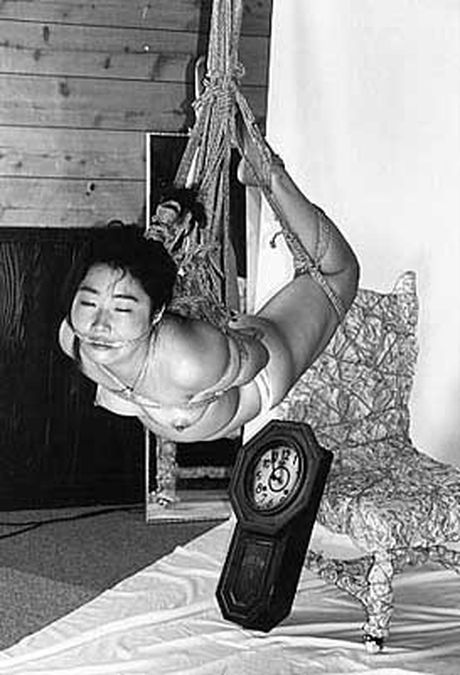 Asian lady in a cage gets her pussy licked and her tits fucked