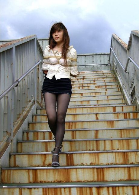 Asian amateur girl strips and shows her perfect ass and tits in a public place