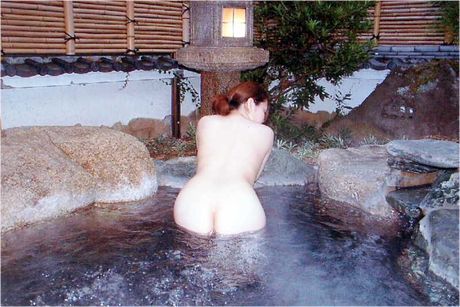 Amateur Asian girl strips and shows her curves in the pool