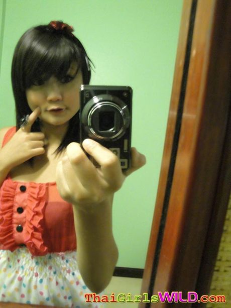 Tiny cute Asian teen doing self shot poses and being naughty