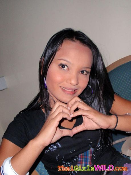 Pretty Thai barslut with a hairy pussy poses, fucks, sucks and spits.