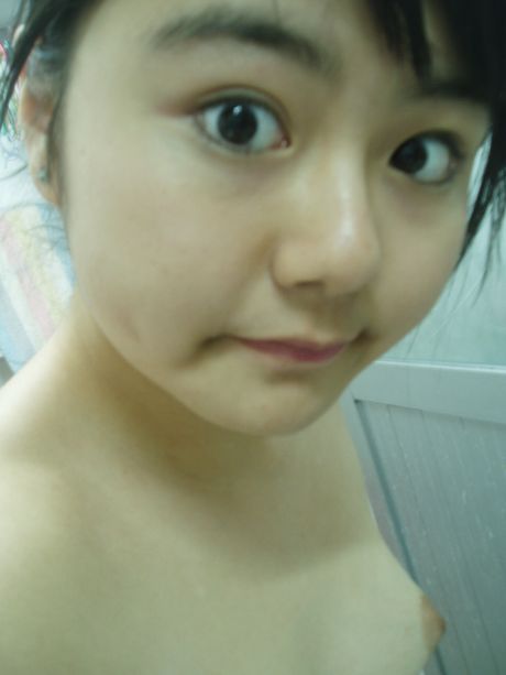 fat teen poses in the mirror with small tits