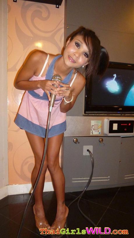 Skinny amateur Asian girl named Earn strips to show off her naked body