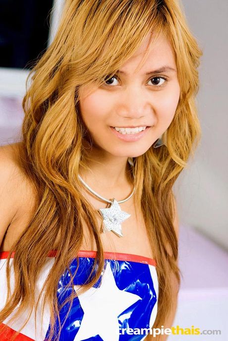 Tiny tit blonde thai girl shows her pink pussy