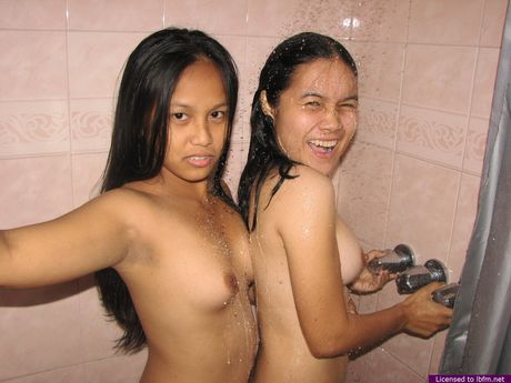 Two sex starved coeds lick their pussies while taking a shower together