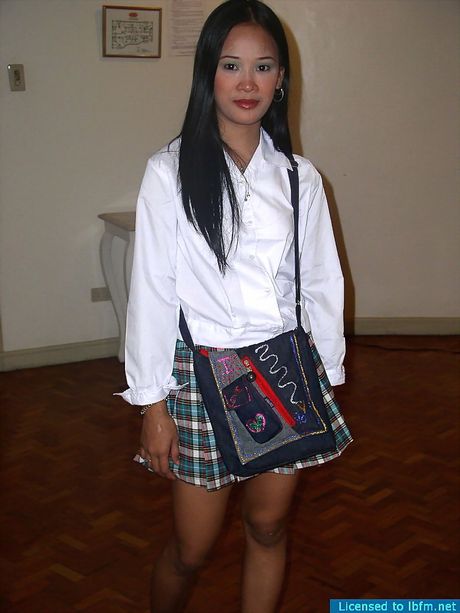 College student lifting her school skirt and spreading her pussy lips to show some pink