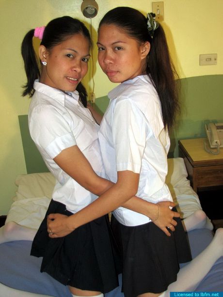 Twin sisters engaged in a hot lesbian show