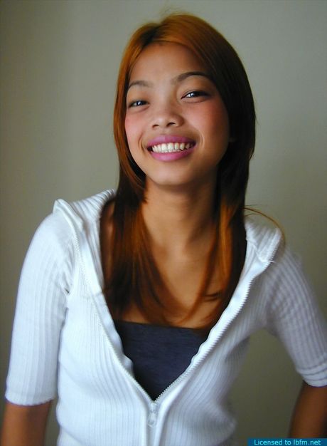 Young hooker stripping in a short-time hotel room