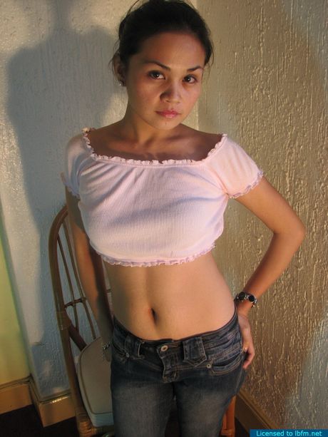 Petite cutie dropping her panties to show her neat trimmed twat