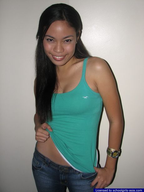 19 year old Trina strips and spreads her legs to show her neat hairless slit