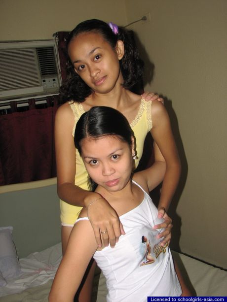 Two cute coeds spend some quality time together naked in a bed pleasuring their pussies