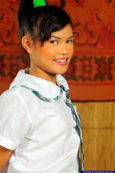 Cute May spreads her legs to flash her salivating hairless pussy