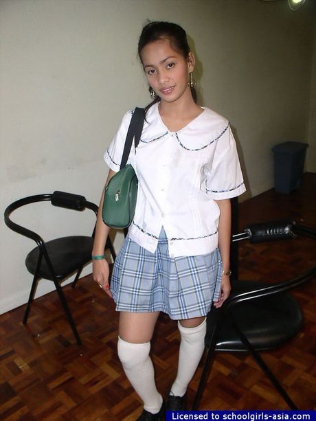 Busty schoolgirl spreading her pussy lips to show some pink