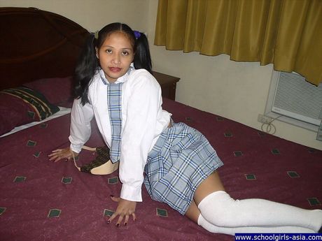 Dark skinned schoolgirl showing her brown orifices for a few bucks