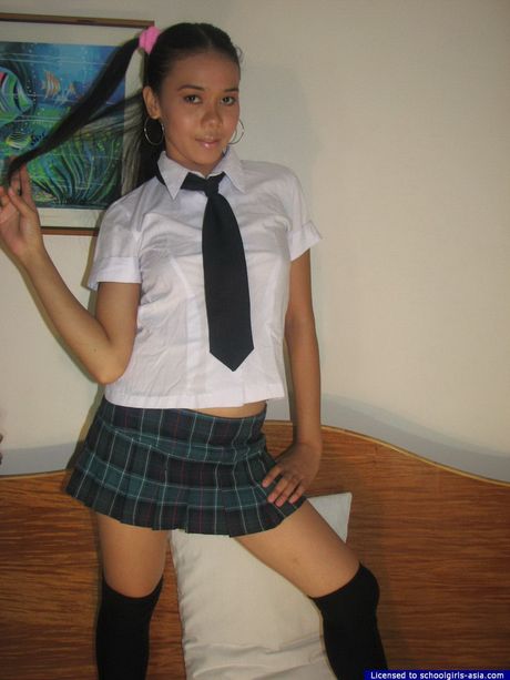 Her name is "Caresse" she strips from her school uniform and she is sexy as hell