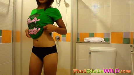 Bum is a cute Thai girl showing while her boyfriend takes pics