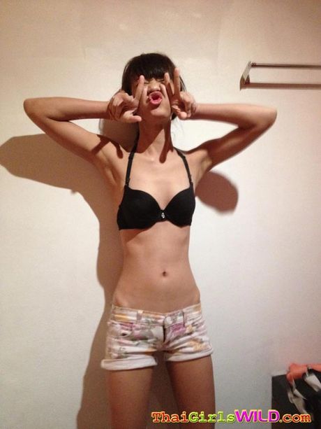 Two Thai teen sluts goof around in the room and take nude pics