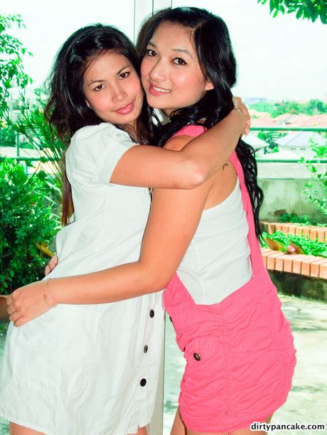 Two amateur Asian girlfriends strip naked together