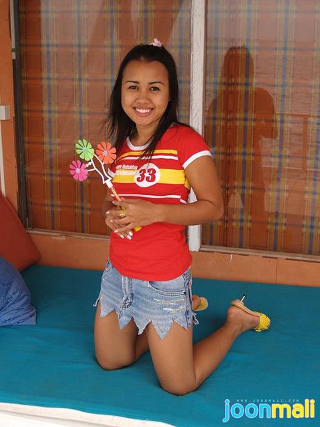 Joon Mali in jean skirt plays with panties and pinwheel