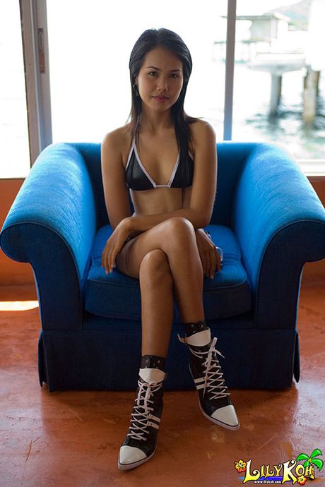 Petite teen slips a finger into her panty covered pussy