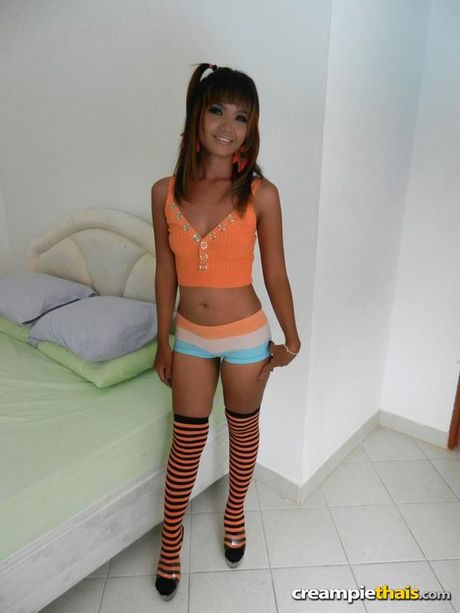 Tight bodied cutie strips and shows her tits and pussy