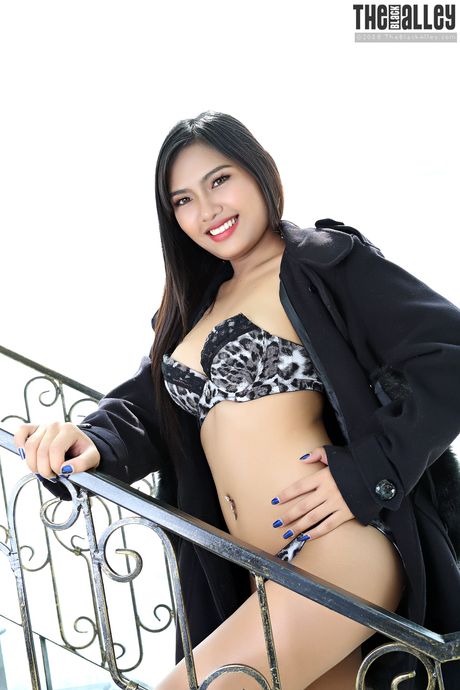 Super hot Asian teen Nittaya strips and shows her tiny tits and pierced pussy