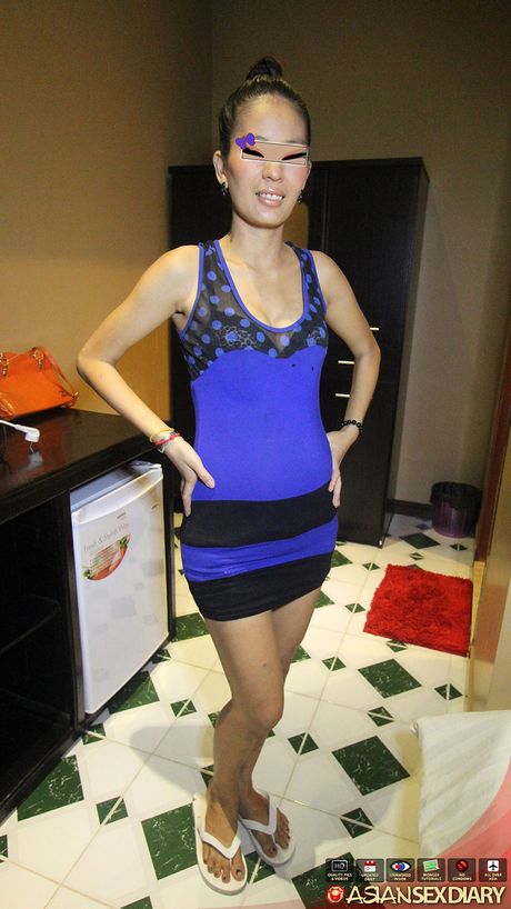 Asian teen Anna strips and shows her tiny tits and pink pussy up close