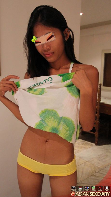 Skinny Asian teen Ashley strips and shows her tiny tits and ass