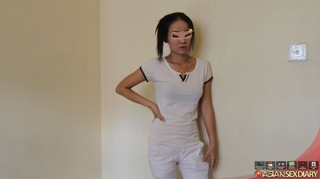 Asian teen Hong strips and shows her tiny tits and pink pussy up close