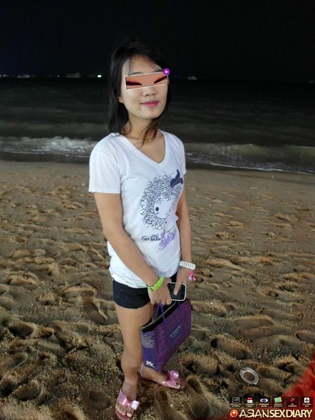 Asian teen Mai strips and shows her tiny tits and pussy on the beach