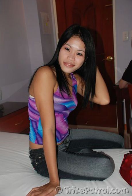 Asian teen Gerelyn strips and plays with her pussy in the bathtub