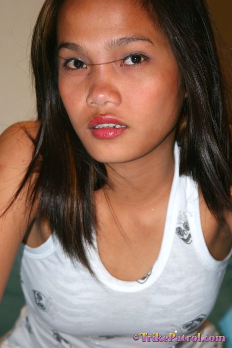 Asian teen Leslie strips and shows her tiny tits and ass in a solo