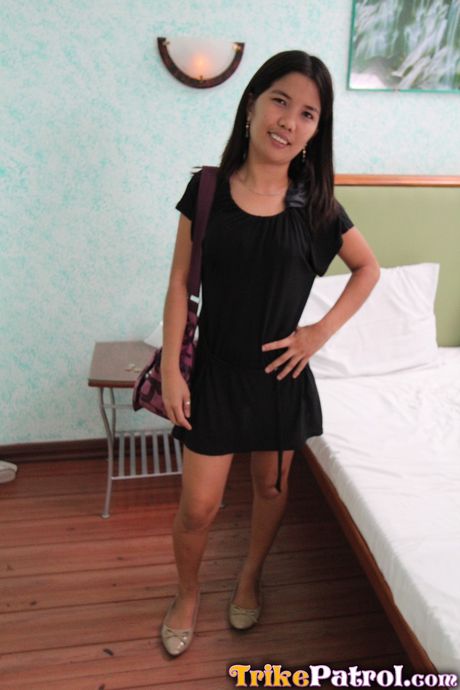 Skinny Asian teen Angel strips and shows her tiny tits and pink pussy