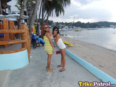 Asian teens Shanelle and Bubbles flaunt their big bootyes on the beach