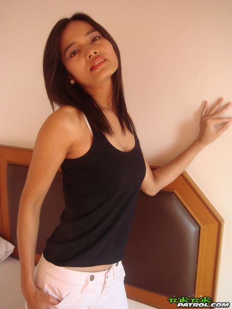 Asian teen Lana fingers her trimmed pussy after a striptease