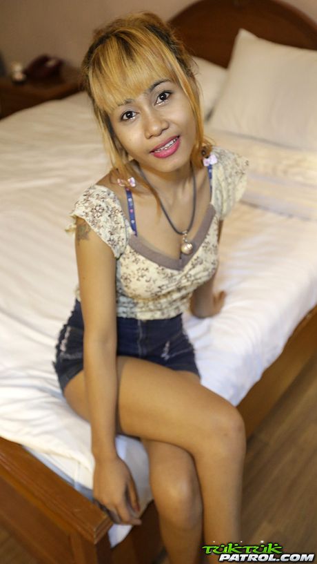 Asian babe Jean strips and shows her tattooed body and her pussy