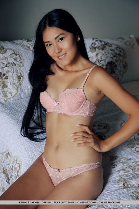 Asian teen Kimiko strips and unveils her tiny tits and shaved pussy
