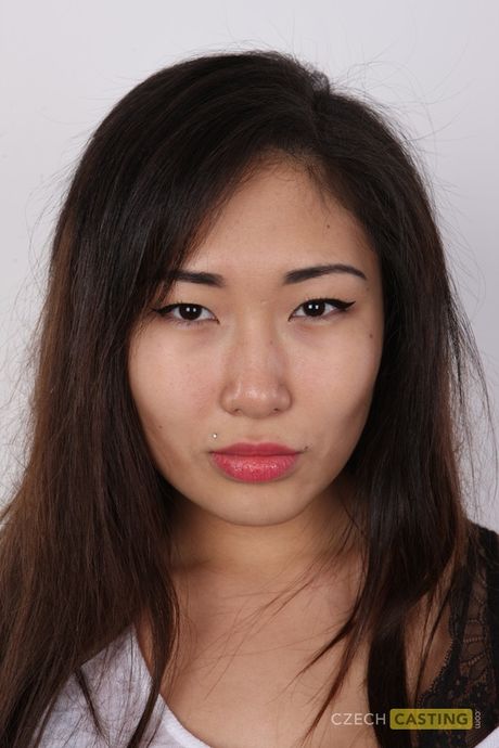 Asian teen Mira strips and shows her amazing boobs and hairy cunt in a solo