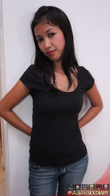 Asian teen Angel strips and shows her tiny tits and trimmed pussy