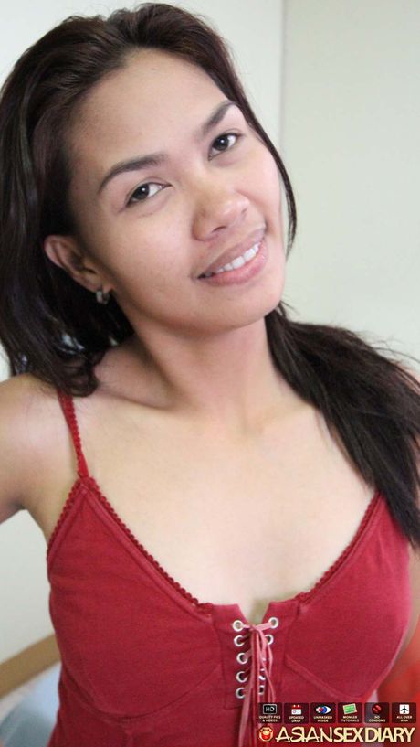 Skinny Asian teen Erika strips and shows her tiny tits and pussy