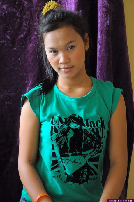 Asian amateur girl with tiny tits and hairy pussy strips and exhibits nudity