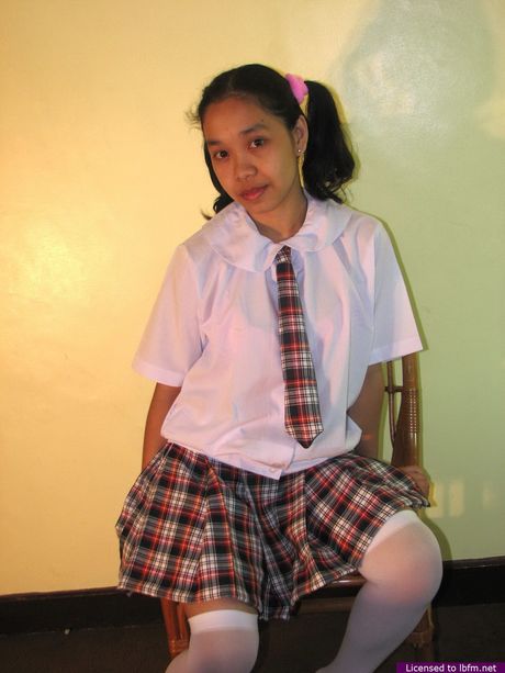 Asian schoolgirl amateur strips and unveils her tiny tits and pussy